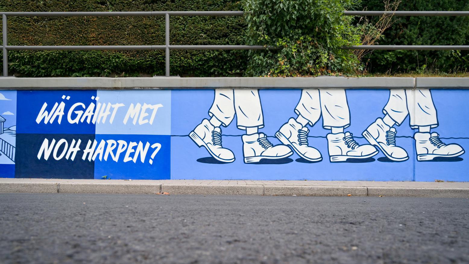 Stützwand, welche mit Motiven der Bochumer Maischützen besprüht ist.